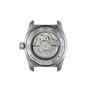 Tissot watch back cover with mechanical movement on a white background