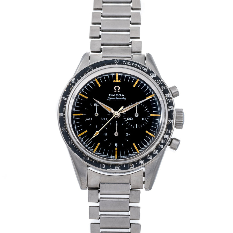 An OMEGA Speedmaster wristwatch featuring a black dial, metal strap, and tachymeter bezel.