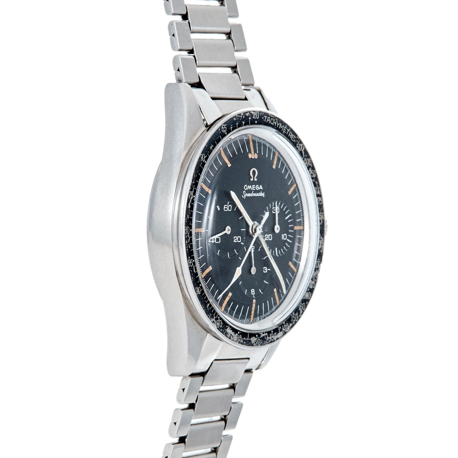 Side view of a stainless steel Speedmaster Ed White by Watches of Switzerland, featuring a black dial and worn tachymeter bezel.