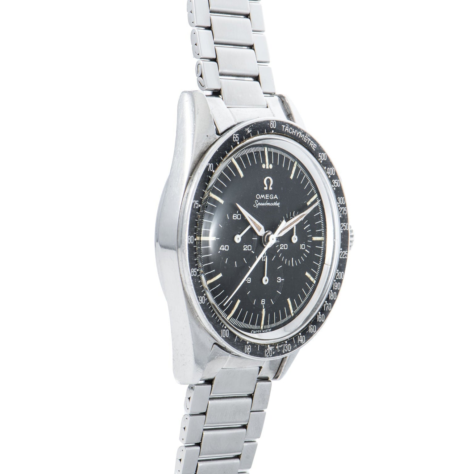 An OMEGA Speedmaster watch with a silver case, black dial, and metal bracelet, displayed at an angle.