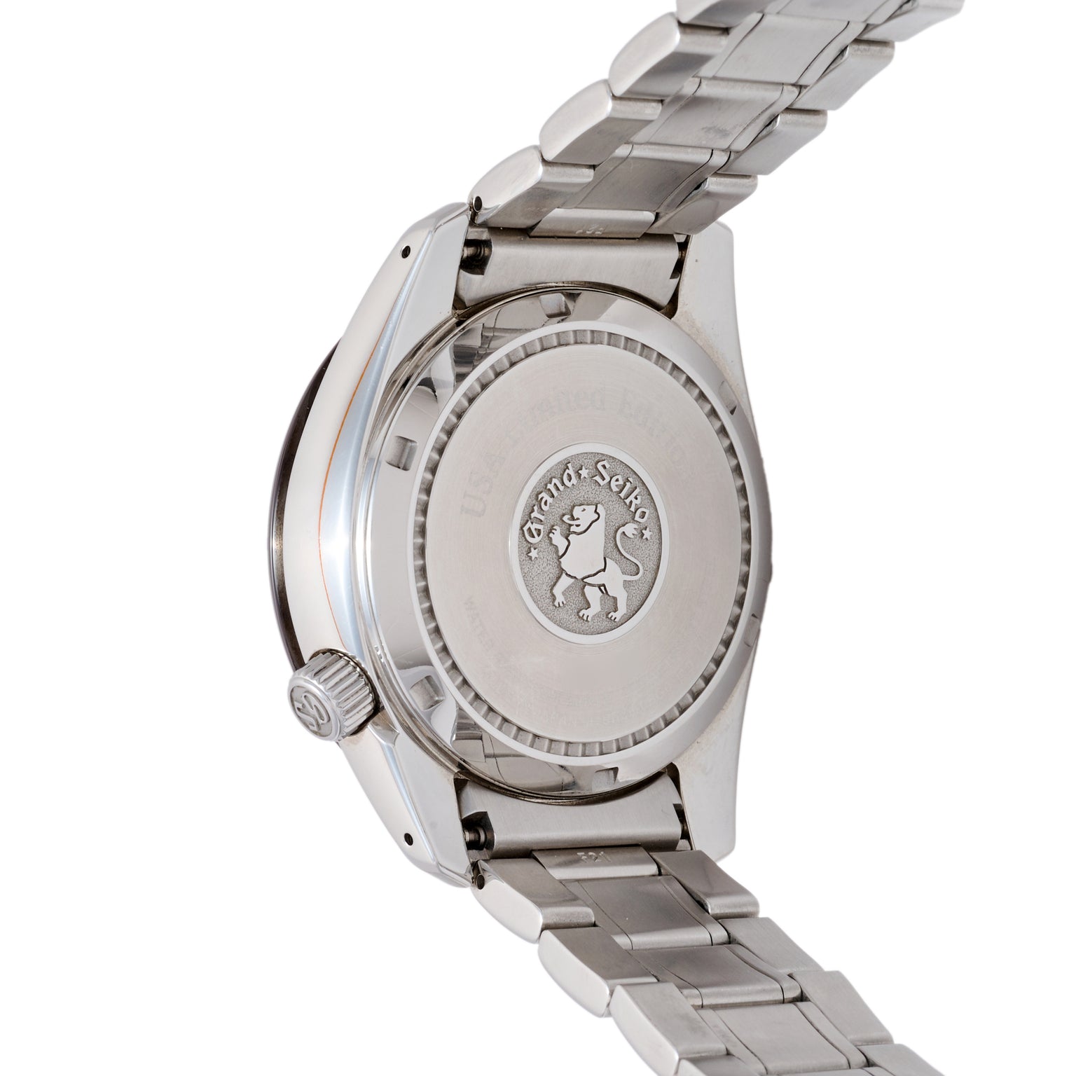 Close-up of a silver watch with brand emblem on a white background