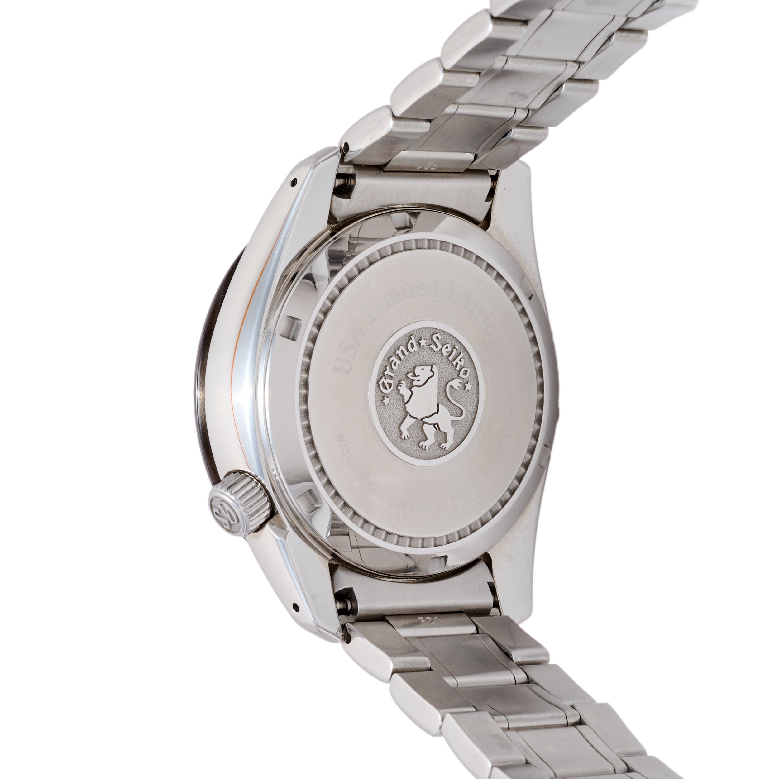 Close-up of a silver watch with brand emblem on a white background