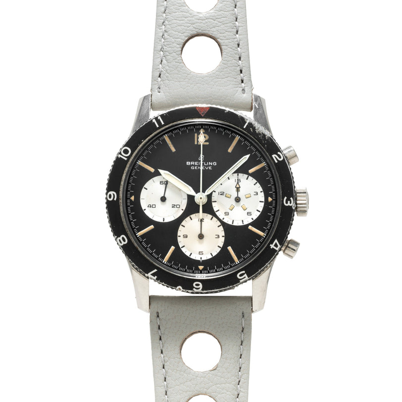 The Breitling Co-Pilot Chronograph features a black dial, white subdials, and a light gray leather strap.
