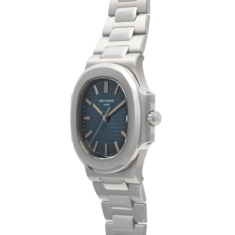 Patek Philippe Nautilus wristwatch featuring a blue face and metal band, shown from an angle.