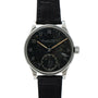 The IWC Schaffhausen Portugieser is a vintage wristwatch featuring a black speckled dial and a black leather strap.
