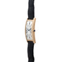 Side view of the Cartier Tank Cintrée Jumbo gold wristwatch featuring a white face, black Roman numerals, and a black leather strap.