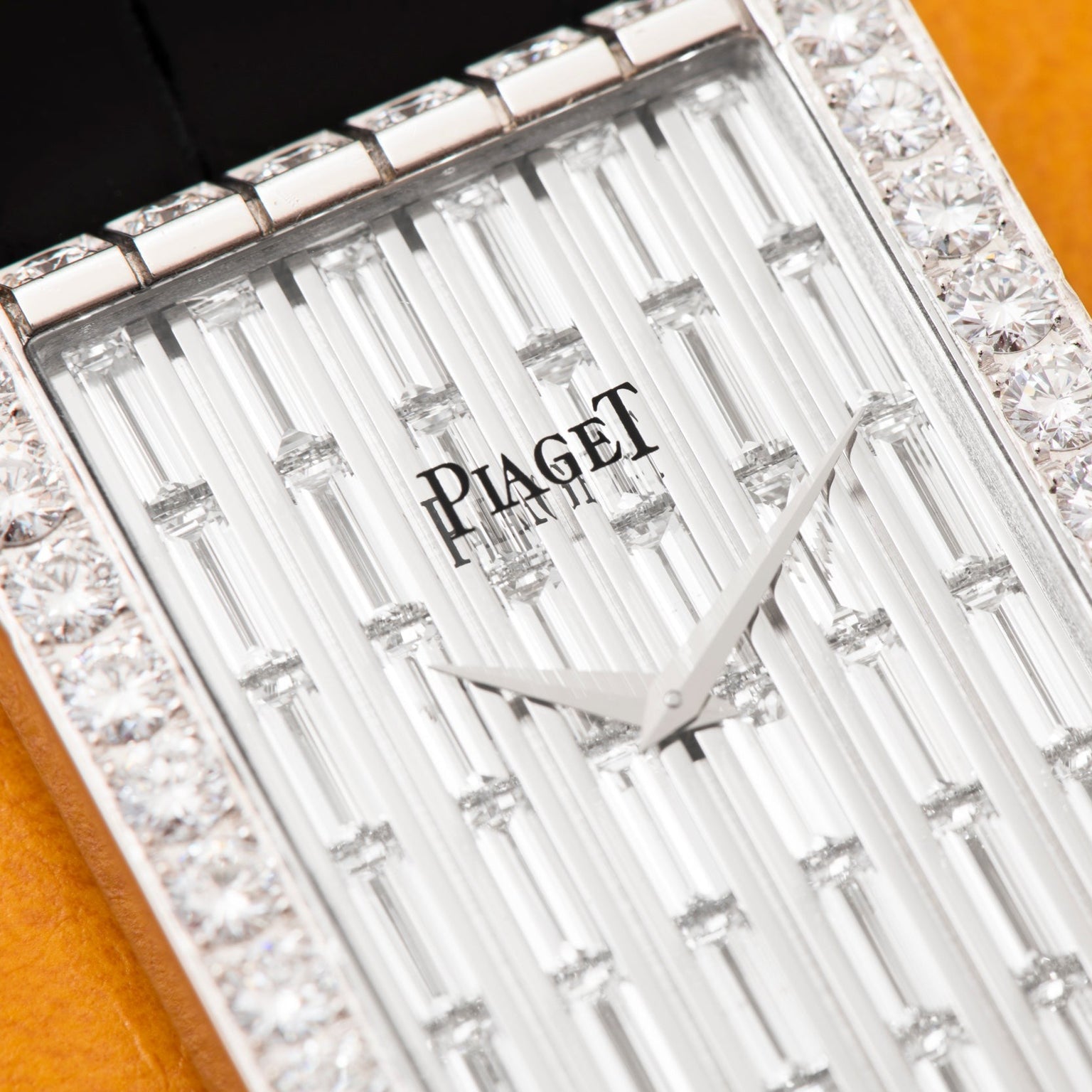 Close-up of Piagets Limelight Baguette Diamond Dress Watch, featuring a rectangular face with diamond accents and silver hands, time set to 2:05.