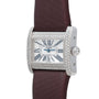 Cartier Tank Divan watch featuring a diamond bezel, Roman numerals, and brown strap, shown from an angled view.