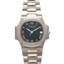 The Patek Philippe Nautilus is a silver wristwatch featuring a black face, Roman numerals, and a date window at 3 oclock.