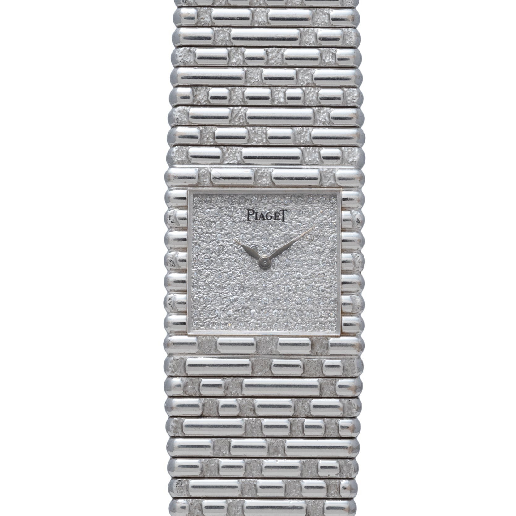A Piaget Emperador Diamond wristwatch featuring a silver-tone textured square face and a brick-patterned metal band.