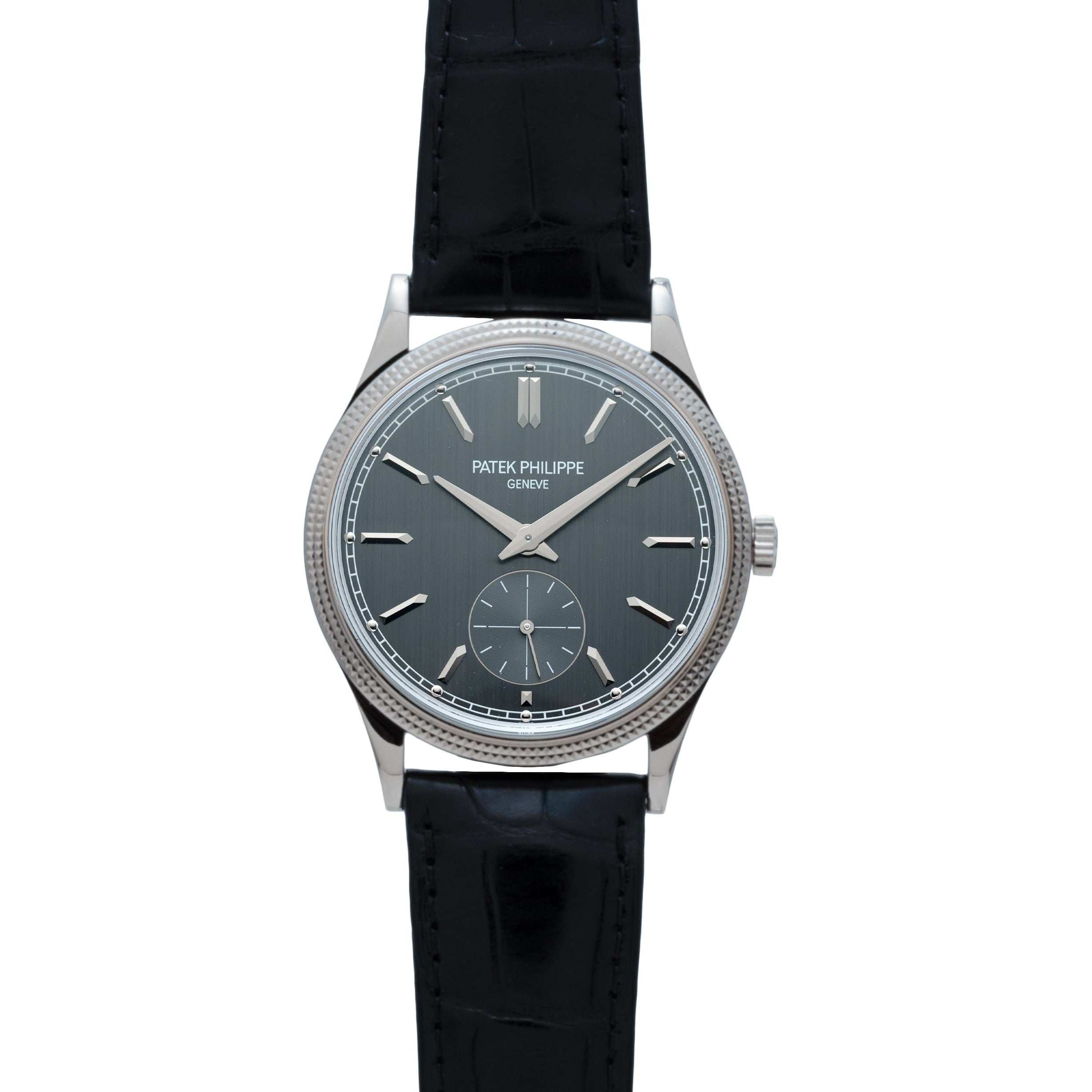 The Patek Philippe Calatrava wristwatch features a black leather strap and a dark gray dial for elegant time display.