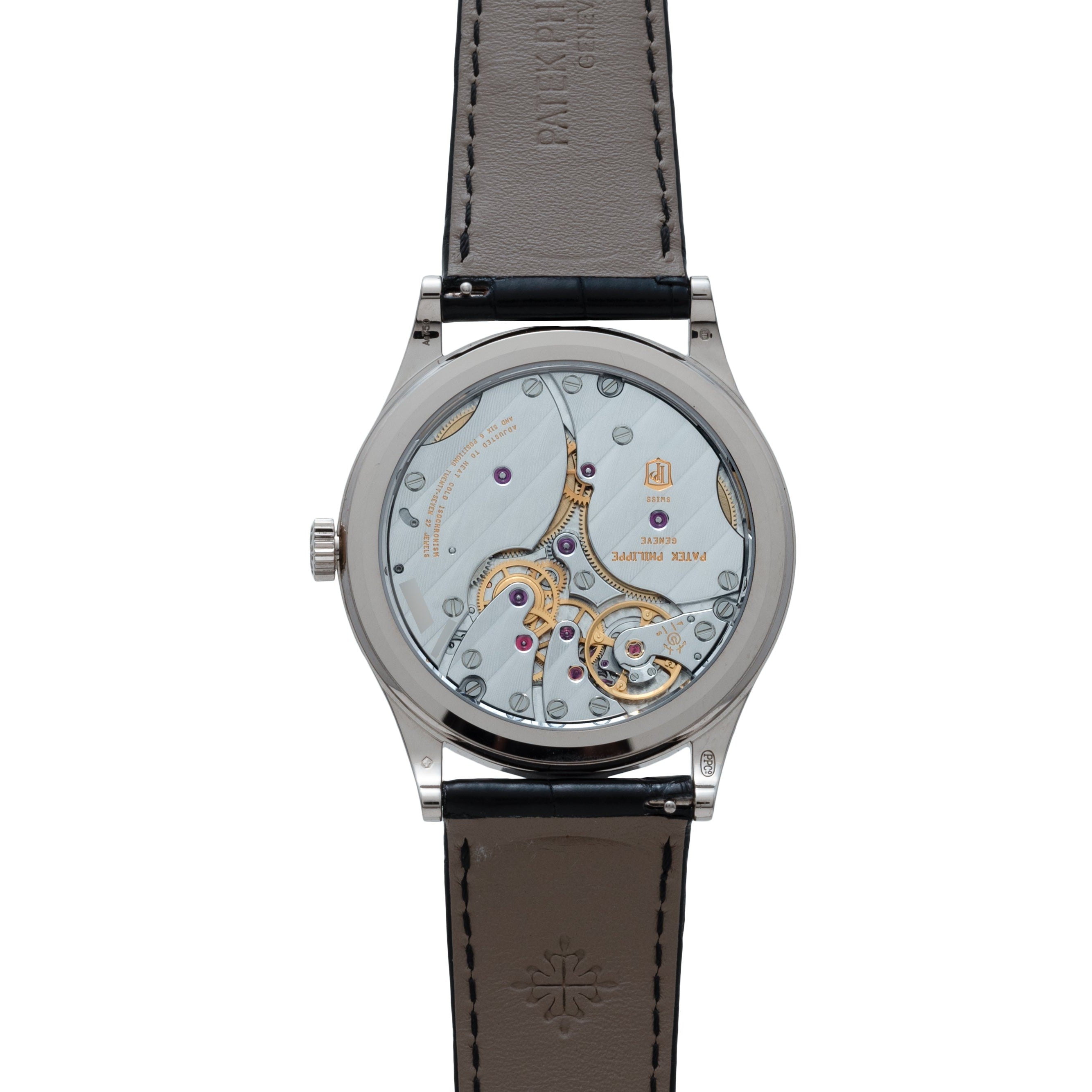 Back view of the Patek Philippe Calatrava wristwatch displays its intricate mechanical movement and elegant leather strap.