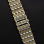 The Piaget Polo Pave wristwatch features rows of sparkling diamonds in gold and silver on a black textured background.