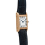 Cartier Tank Normale watch featuring a gold case, white dial with black Roman numerals, blue hands, and a black leather strap.