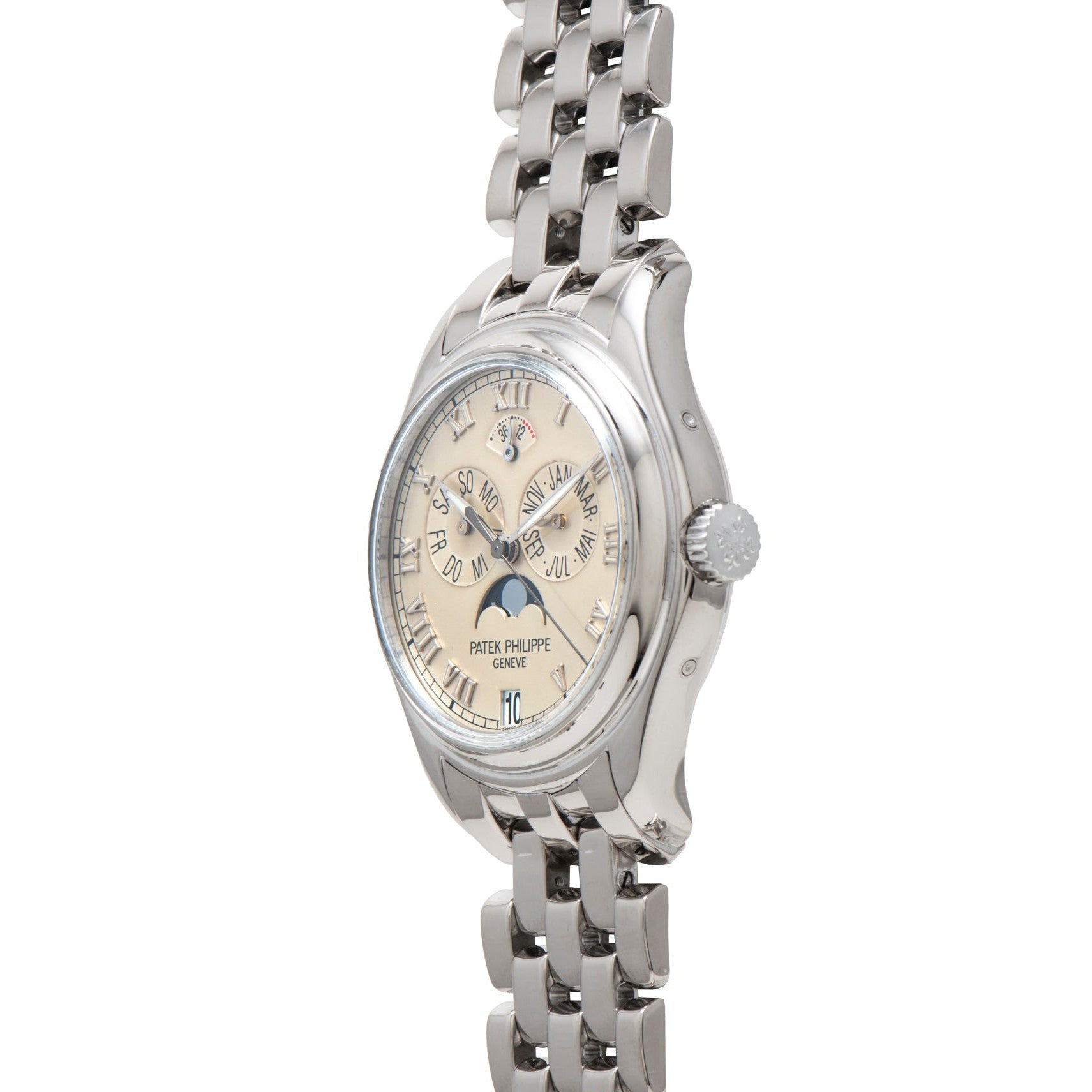 Patek Philippe Annual Calendar wristwatch with metal link band and cream dial, displayed at an angle.