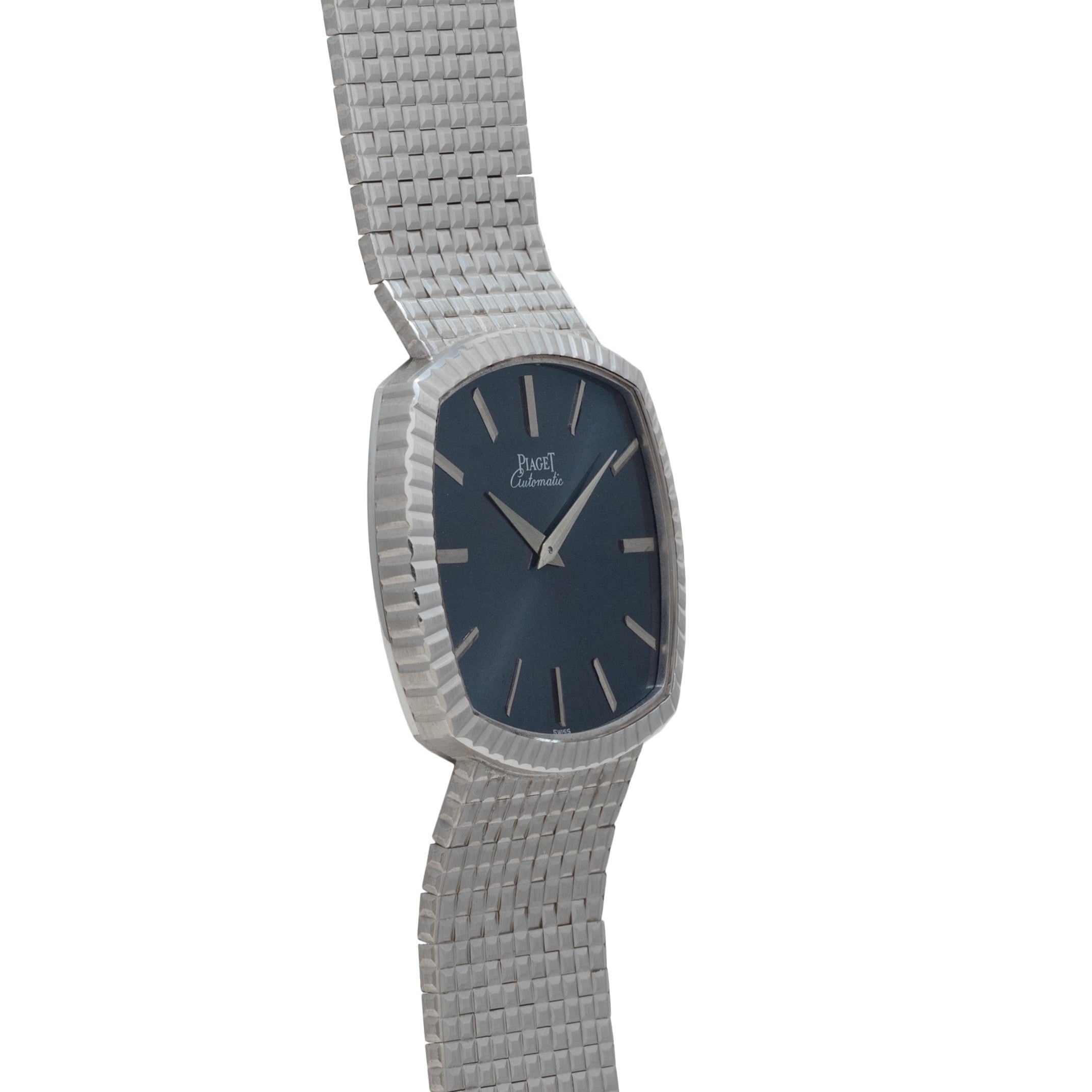 The Piaget Sqound White Gold Dress Watch features a textured metal band and a dark blue, rectangular face angled to the side.