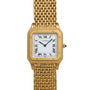 A Cartier Santos Dumont gold wristwatch featuring a square face, Roman numerals, and a mesh band.