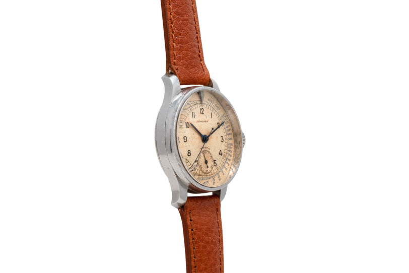 Longines vintage chronograph watch with cream dial, Arabic numerals, and brown leather strap.