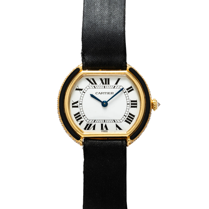 Cartier Ellipse Gondole watch with gold-tone case, white dial, Roman numerals, and black fabric strap.