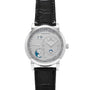 The Lange & Sohne Lange 1 Tourbillon Perpetual Calendar is a silver luxury wristwatch with a black leather strap, featuring multiple dials plus date and moon phase indicators.