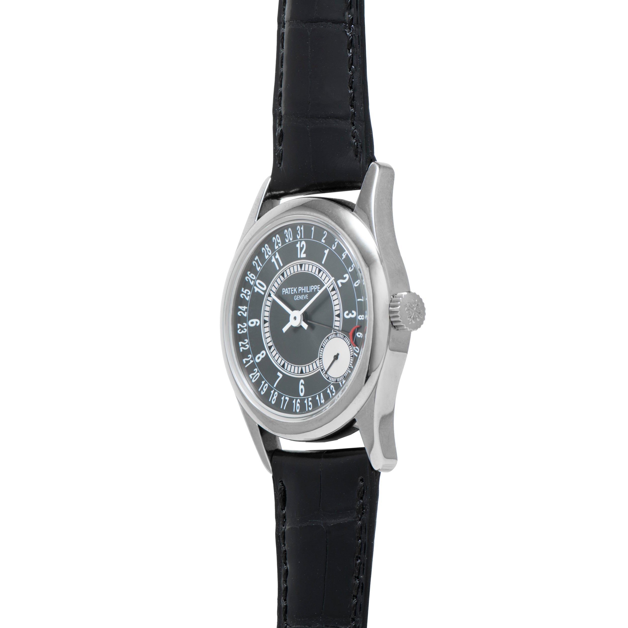 The Patek Philippe Calatrava is a silver wristwatch featuring a black leather strap and a circular date display.