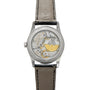 Back view of the Patek Philippe Calatrava luxury watch, showcasing its visible mechanical movement and black leather strap.
