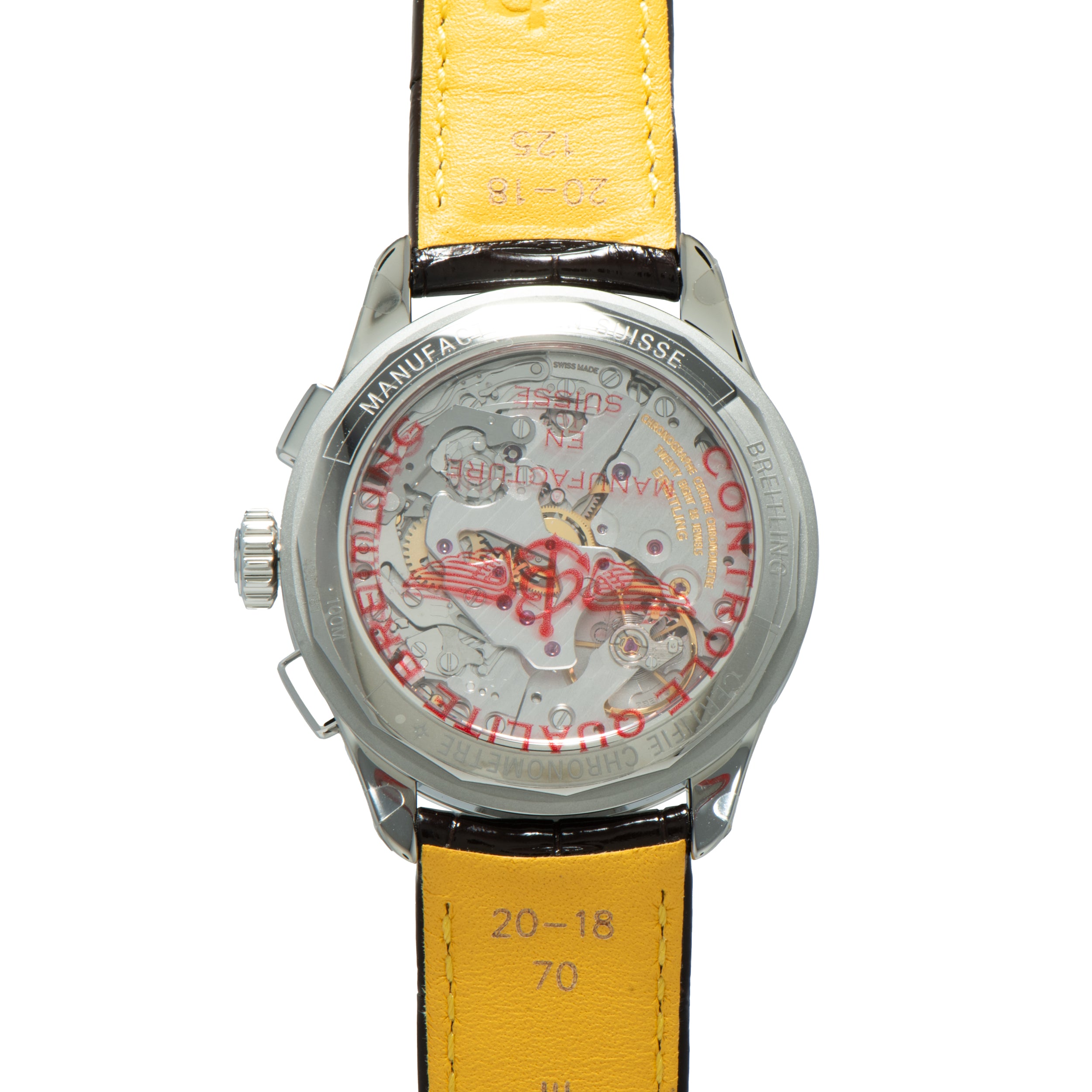 Back of a Breitling Premiere B09 Chronograph 40 with a transparent case revealing inner mechanisms and a yellow leather strap.