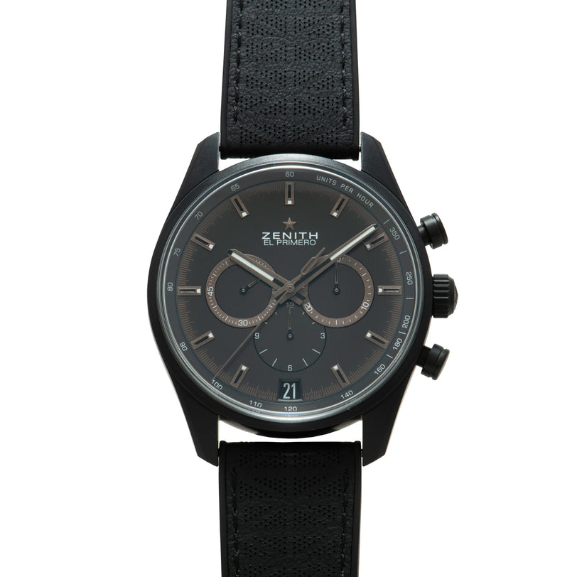 Black Zenith El Primero chronograph watch with dark dial, dual subdials, and black leather strap.