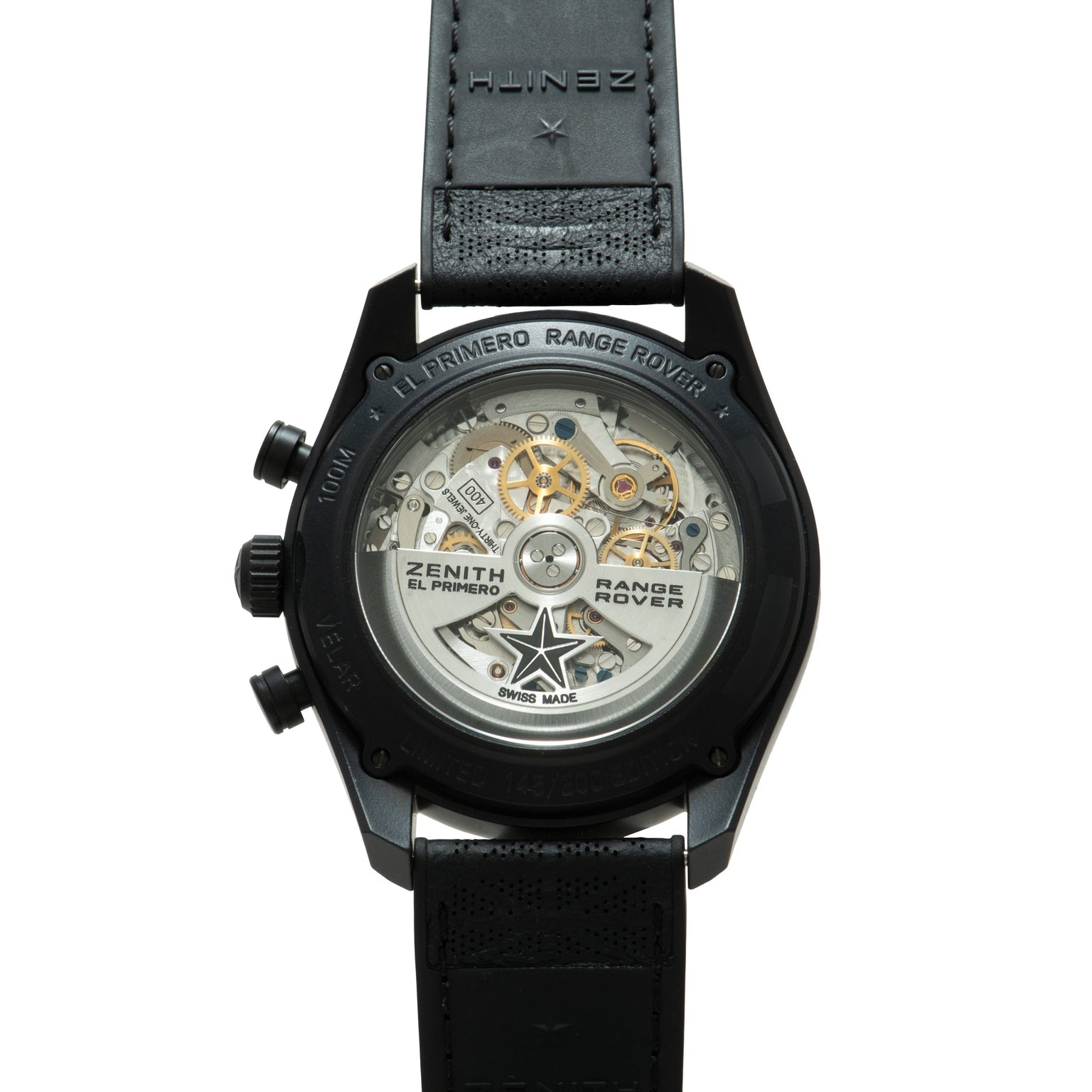 Black chronograph watch with visible skeleton caseback showing gold-tone mechanical movement, black leather strap, and "El Pr
