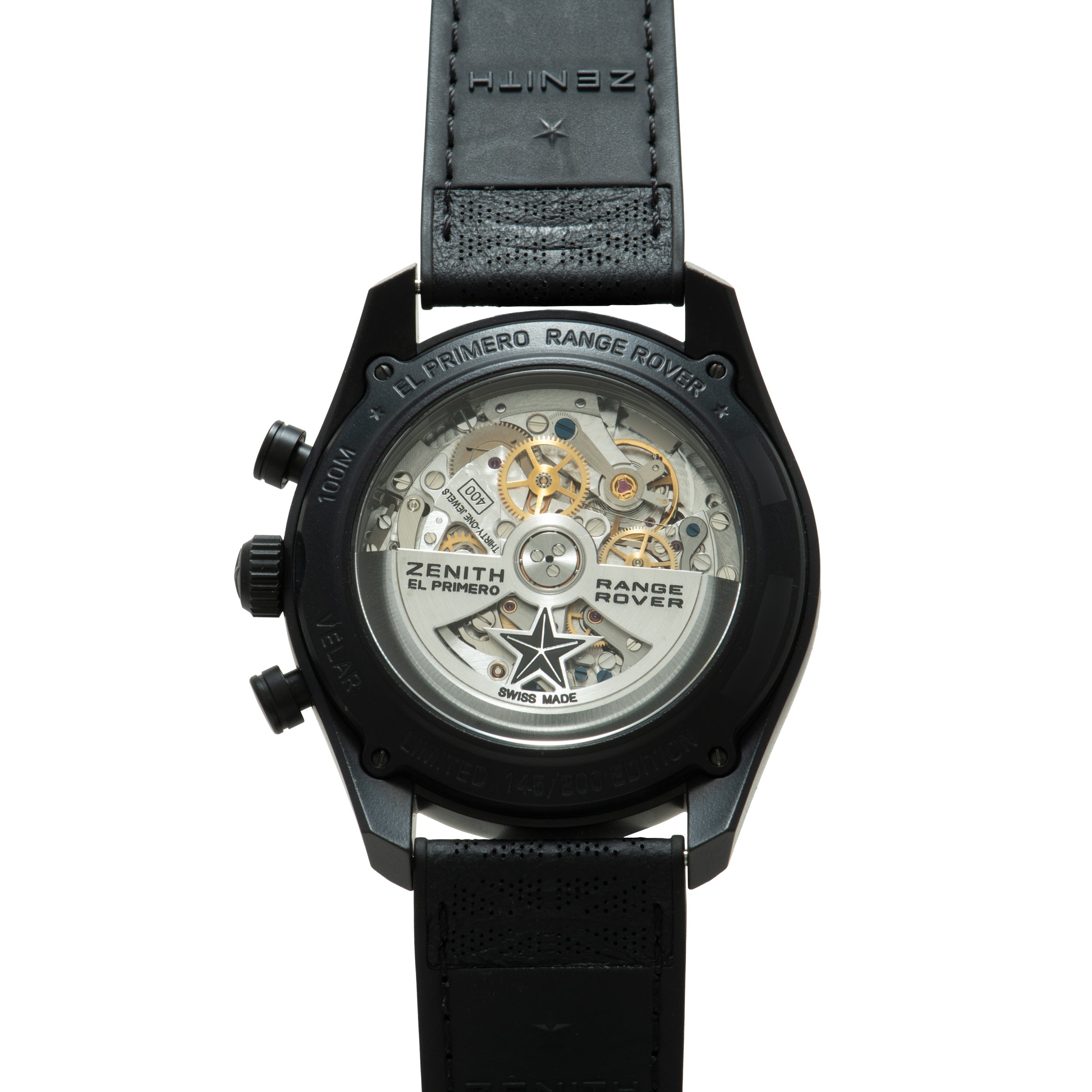 Black chronograph watch with visible skeleton caseback showing gold-tone mechanical movement, black leather strap, and "El Pr