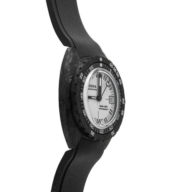 Black carbon dive watch with white dial, black bezel, and black rubber strap, displayed at an angle.