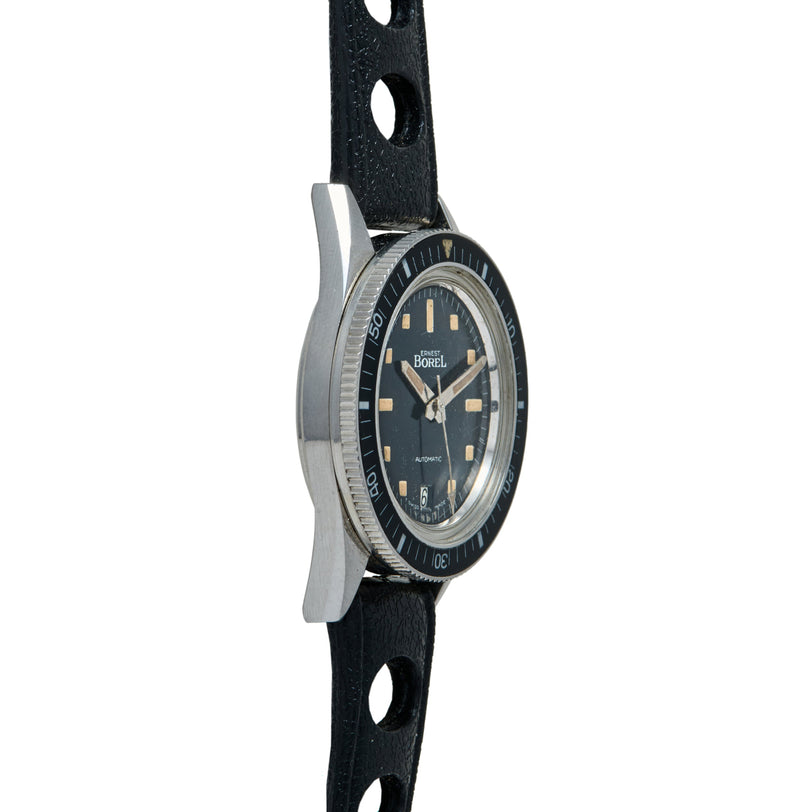 Ernest Borel Diver watch with dark dial, gold hour markers, rotating bezel, and black leather rally strap.