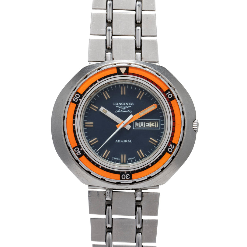 Longines Admiral Diver watch with orange bezel, dark dial, orange hands, date window, and stainless steel bracelet.