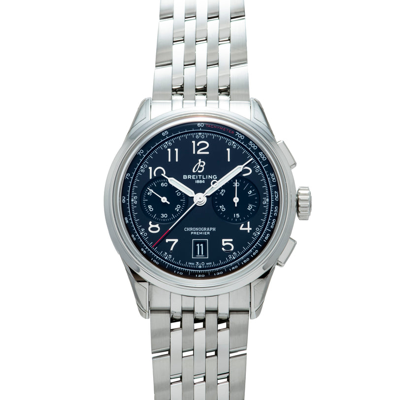 Silver stainless steel chronograph watch with black dial, Arabic numerals, date window, and multi-link bracelet.