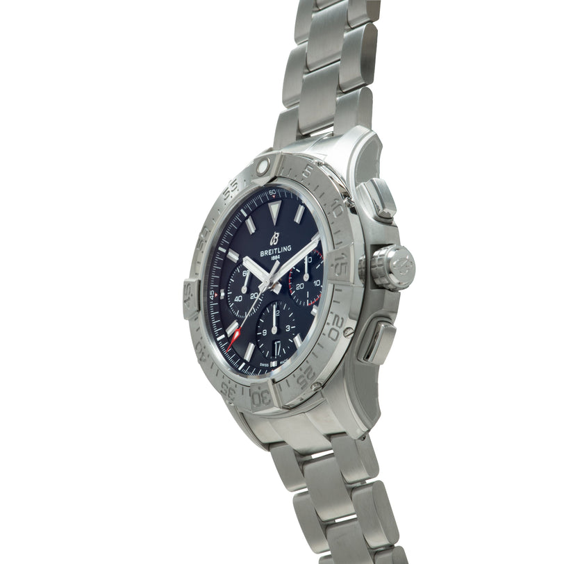 Stainless steel chronograph watch with dark blue dial, white hands, red accent, and matching metal bracelet.