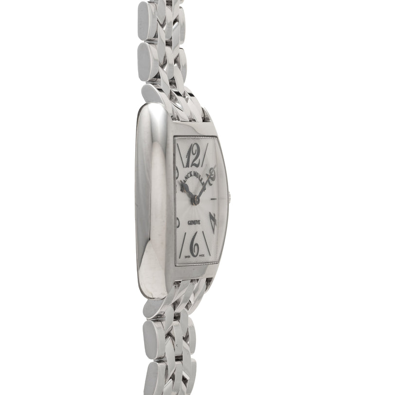 Platinum watch with curved rectangular face, Arabic numerals at 12 and 6, linked bracelet band, and "Genève" text on dial.