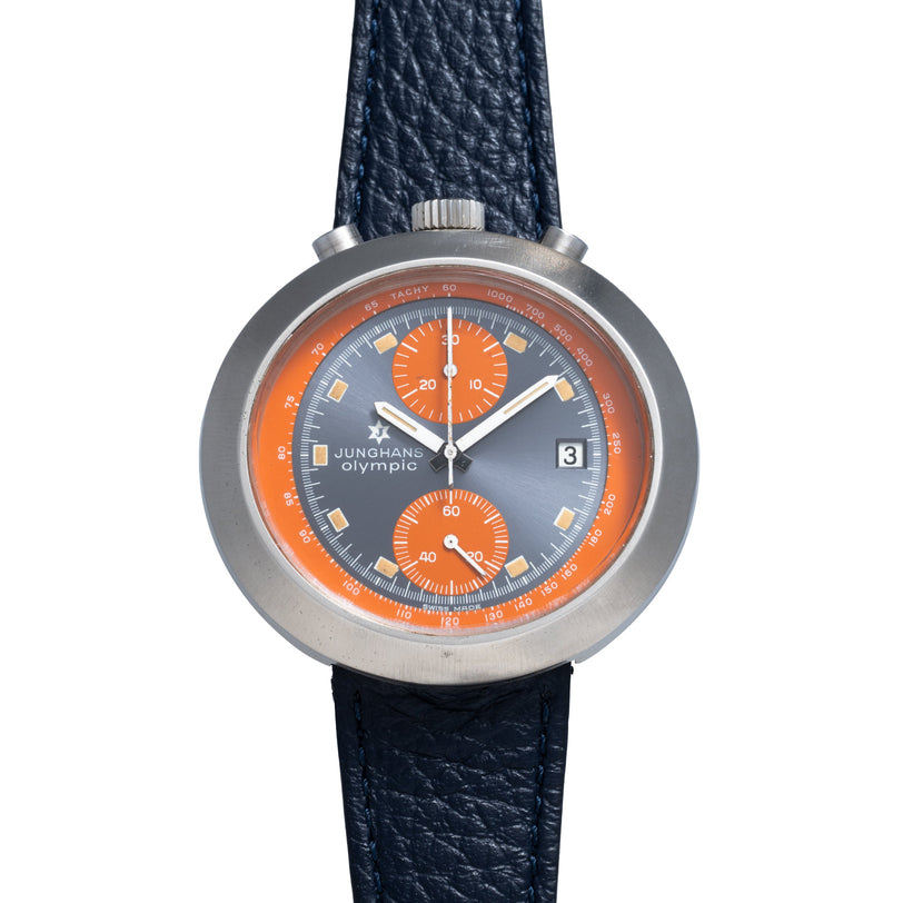 Junghans Olympic chronograph watch with gray case, orange and dark blue dial, orange subdials, and dark blue leather strap.