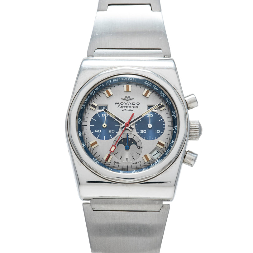 Stainless steel chronograph watch with silver dial, blue subdials, gold hour markers, red chronograph hands, and moon phase d