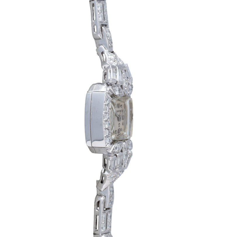 Silver-tone rectangular watch with crystal-embellished bezel and matching bracelet featuring geometric links.