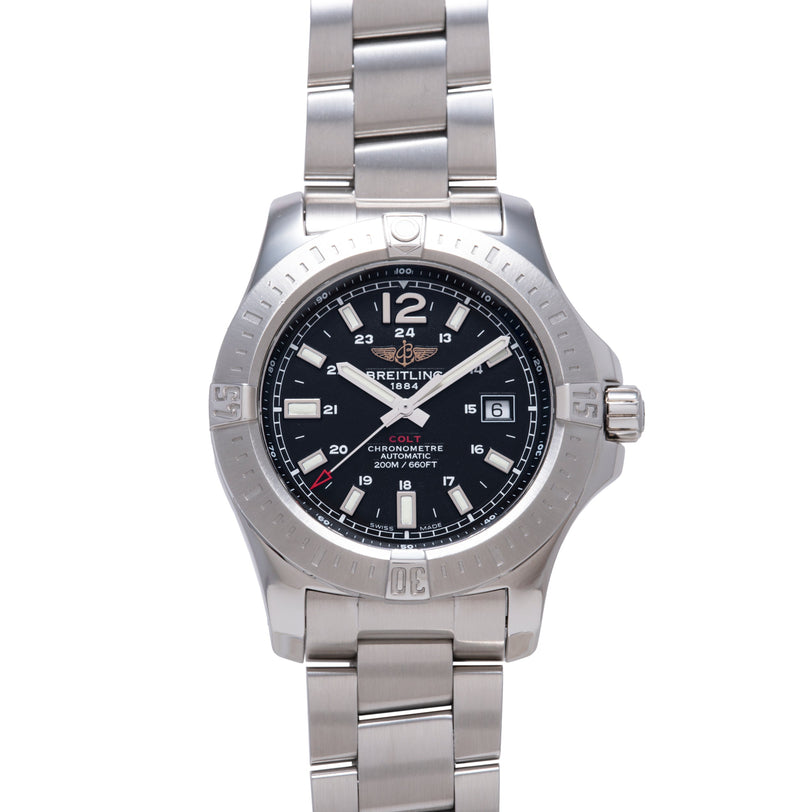 Breitling Colt stainless steel watch with black dial, white Arabic numerals, date window, and linked metal bracelet.