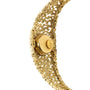 Gold-toned bracelet watch with textured link band and circular dial with Omega branding, shown at an angle.