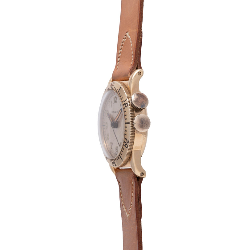 Longines Weems watch with silver dial, gold-tone case, two pushers, and brown leather strap with stitching detail.