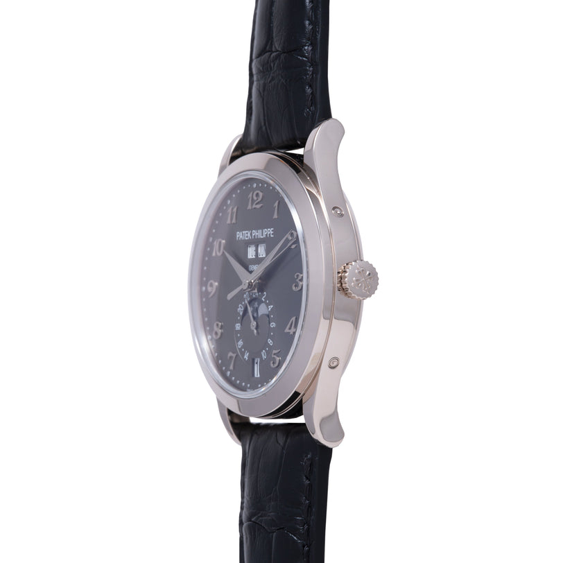 Silver-tone watch with dark dial, Arabic numerals, moon phase subdial, and black leather crocodile strap.