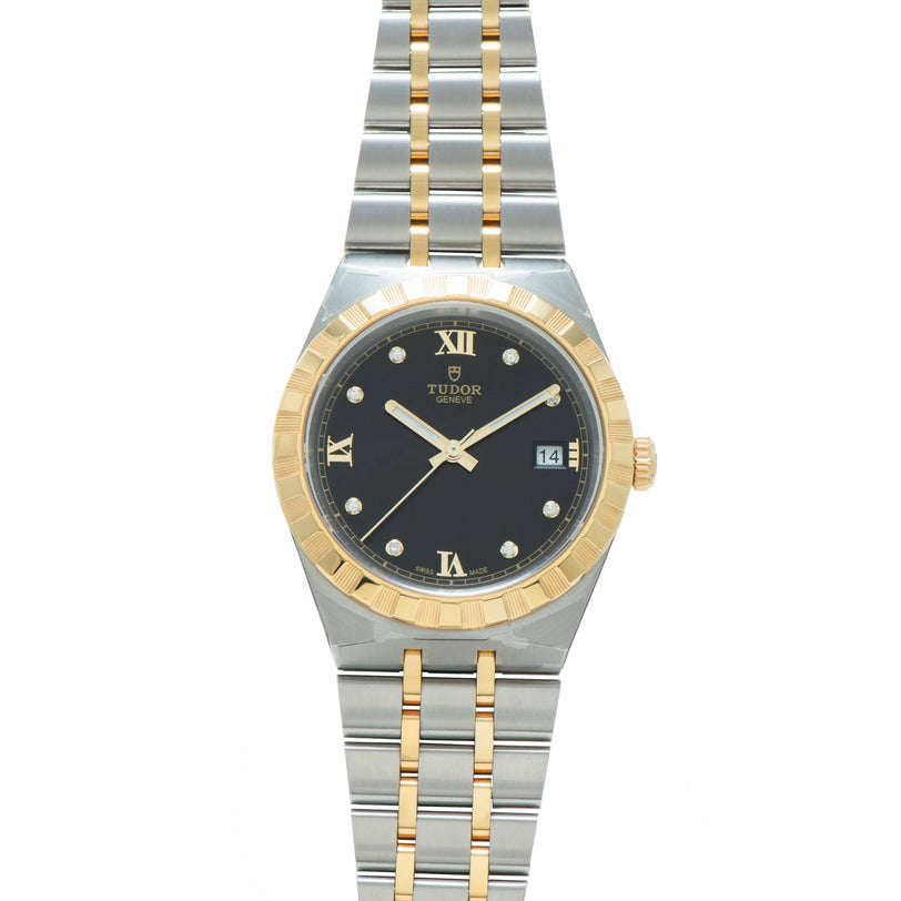 Tudor 38mm watch with steel and gold two-tone bracelet, black dial with Roman numerals, and date window.