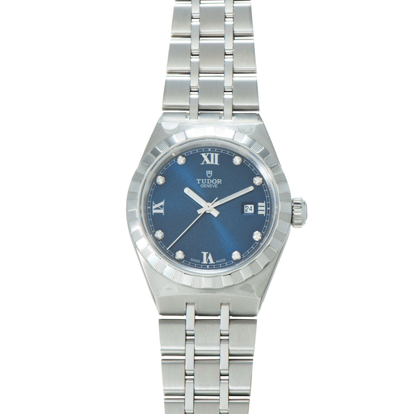 Steel watch with blue dial, diamond hour markers, Roman numerals, date window, and three-link bracelet.