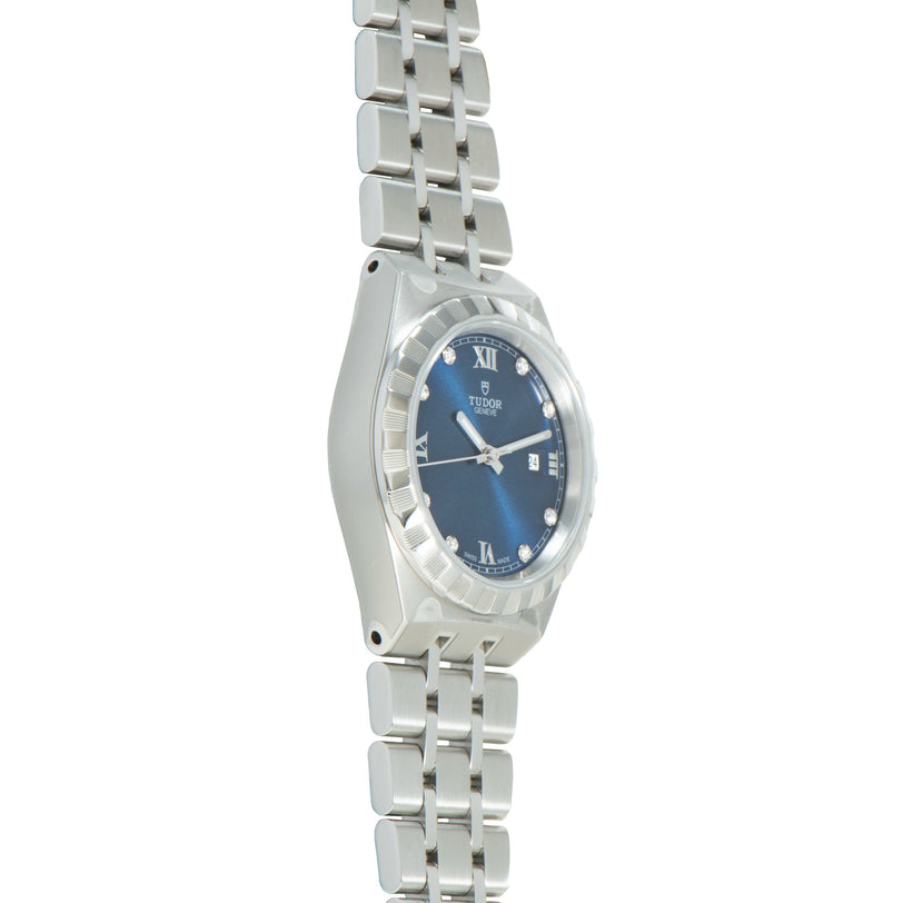 Steel watch with blue dial, Roman numerals, diamond hour markers, date window, and steel bracelet.