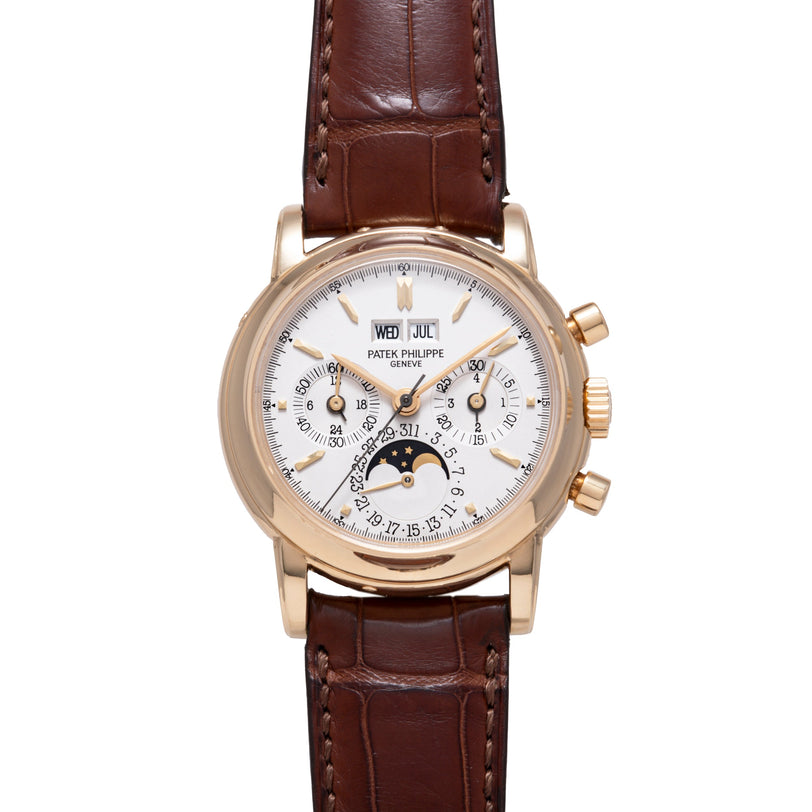 Rose gold watch with white dial, day-date window, chronograph subdials, moonphase indicator, and brown leather strap.