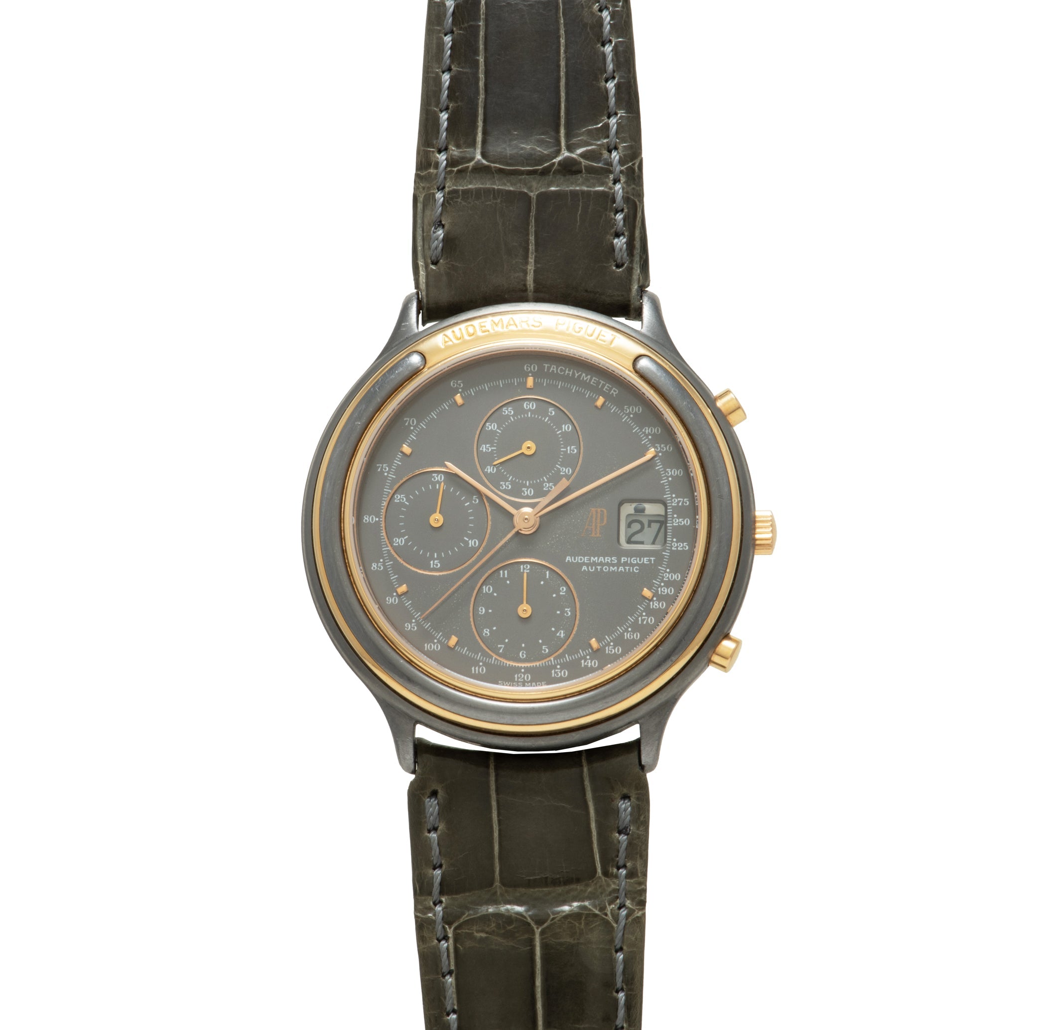 Two-tone chronograph watch with dark gray dial, three subdials, date window, and crocodile leather strap with white stitching