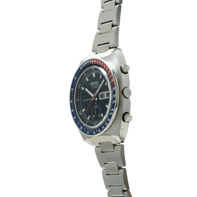 Seiko chronograph watch with stainless steel case, black dial, blue and red rotating bezel, three subdials, and matching brac