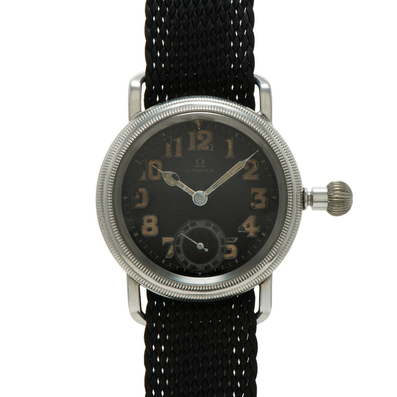 Silver-tone watch with black dial, Arabic numerals, subsidiary dial, and black fabric strap.